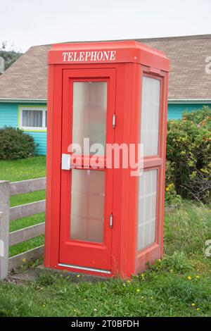 Red telephone booth in St. Pierre, France Stock Photo