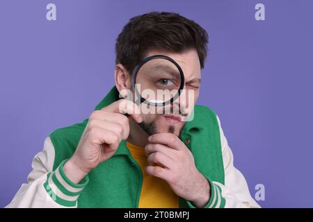 Confused Man Look Through Magnifying Glass And Shrugging Clueless 