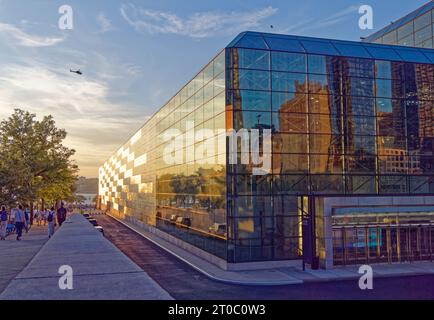 Jacob K. Javits Convention Center glows in the sunset, adjacent to Hudson Yards. The complex encloses its halls with “space frame” construction. Stock Photo