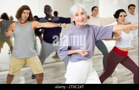 Group of multinational people practicing new modern dance techniques Stock Photo
