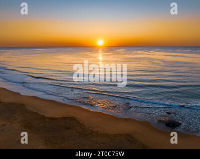 Sunrise seascape with clear skies at Shelly Beach on the Central Coast, NSW, Australia. Stock Photo