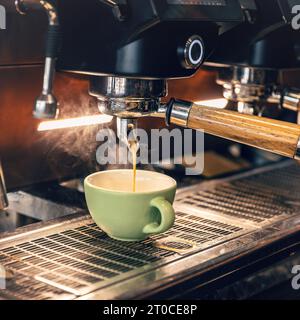 Coffee extraction from professional coffee machine Stock Photo