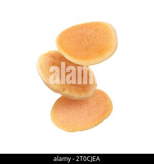 Tasty fresh pancakes falling on white background Stock Photo