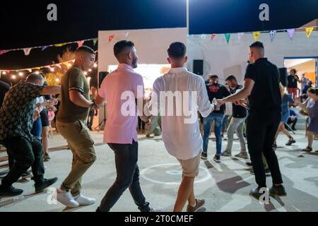 Ios, Greece - September 7, 2023 : 7, 2022 :  A traditional festival in Ios Greece where locals and tourists dancing and celebrating the Holy Mary Stock Photo