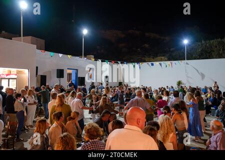 Ios, Greece - September 7, 2023 : 7, 2022 :  A traditional festival in Ios Greece where locals and tourists dancing and celebrating the Holy Mary Stock Photo