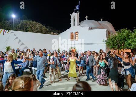 Ios, Greece - September 7, 2023 : 7, 2022 :  A traditional festival in Ios Greece where locals and tourists dancing and celebrating the Holy Mary Stock Photo