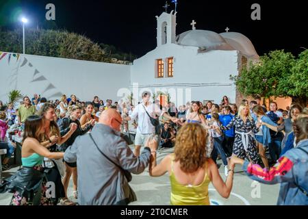 Ios, Greece - September 7, 2023 : 7, 2022 :  A traditional festival in Ios Greece where locals and tourists dancing and celebrating the Holy Mary Stock Photo