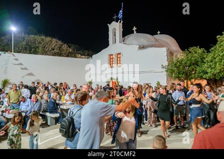 Ios, Greece - September 7, 2023 : 7, 2022 :  A traditional festival in Ios Greece where locals and tourists dancing and celebrating the Holy Mary Stock Photo