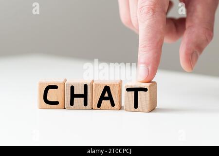 Word CHAT made with wood blocks on a light background Stock Photo