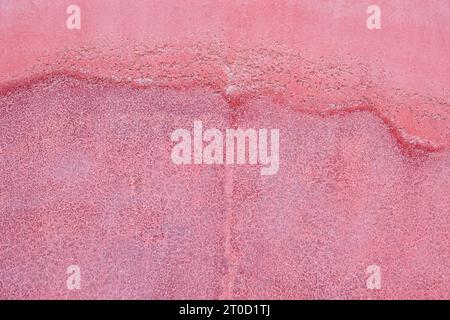 Damp stains on a red wall. Home damage and renovation Stock Photo
