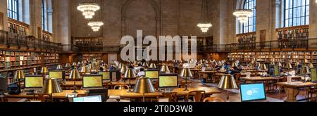 NEW YORK PUBLIC LIBRARY, USA - SEPTEMBER 18, 2023.  A panoramic interior of students reading and researching subjects in the historic Rose Main Readin Stock Photo