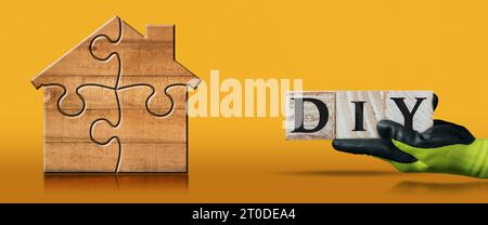 Gloved hand with work glove holding a Diy text made of wooden blocks, on an orange background with a wooden house formed from jigsaw puzzle pieces. Stock Photo