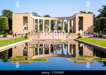 Memorial in the Normandy American Cemetery in Colleville-sur-Mer, a WWII military cemetery near Omaha beach, mirroring in the reflecting pool. Stock Photo