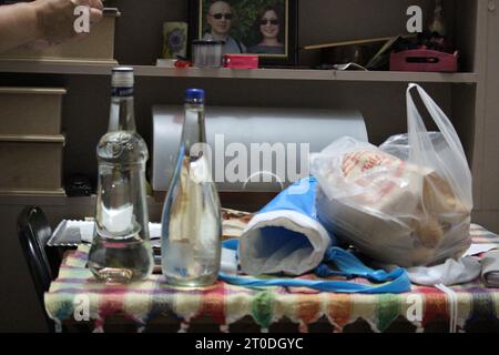 A vibrant collection of bottles and bags lay scattered on the table, beckoning to be filled with the promise of flavorful food and exciting new experi Stock Photo