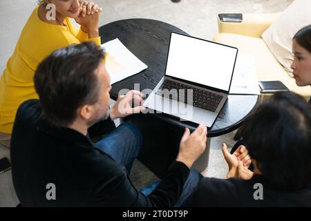 Group of diverse employees business people team during brainstorming. They are discussing new ideas for the new project. Multiracial coworkers working Stock Photo