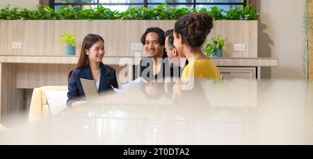Group of diverse employees business people team during brainstorming. They are discussing new ideas for the new project. Multiracial coworkers working Stock Photo