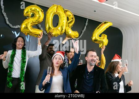 Happy new year 2024 !! A group of diverse business people and colleagues having fun together at a business New Year party. A teamwork celebration of a Stock Photo