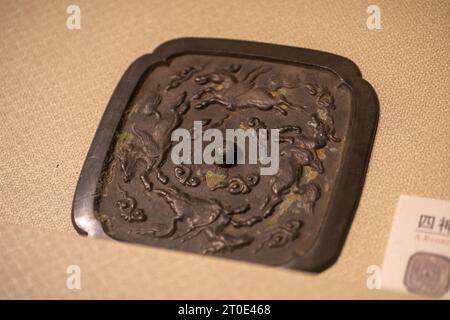 Ancient Chinese Tang Dynasty cultural relics in the museum, bronze mirror Stock Photo