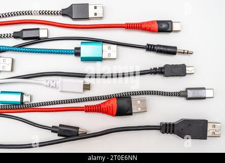 Various types of plugs and cables for audio, video, computer, smartphone and recharging connections. Evolution and change of the types of analog and U Stock Photo