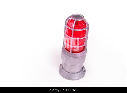 Isolated alarm siren with red glow. Perspective view of an emergency caution warning light or beacon flashing light with metal base. Copy space. Selec Stock Photo