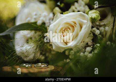 Bridal bouquet and wedding rings Stock Photo