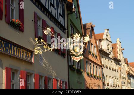 House facade with sign of the Marien-Apotheke at the market place in the morning light, Rothenburg ob der Tauber, Middle Franconia, Romantic Road, Tauber Valley, Bavaria, Germany Stock Photo