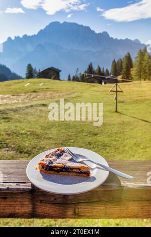 Italy, Veneto, province of Belluno, San Tomaso Agordino, breakfast with blueberry jam tart at the Sasso Bianco refuge in Ciamp, Dolomites Stock Photo
