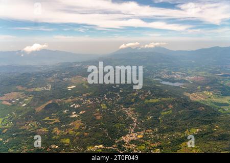 Aerial View of City next to Large Mountains and farm fields Stock Photo