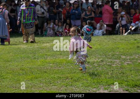 Traditional Pow Wow dance festival. A full day of dancing, drumming and performances. first nations children dance in traditional clothes Stock Photo