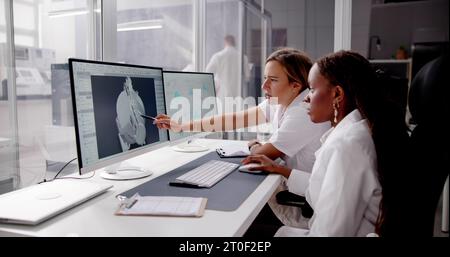 Engineer Doing 3D CAD Model Design On Computer At Factory Stock Photo