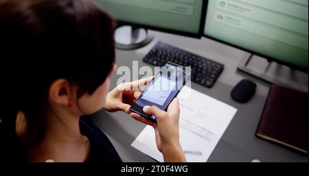 Taking Document Picture Or Photo With Phone. Smartphone Optical Document Stock Photo