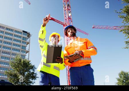OSHA Inspector At Construction Site. Young Engineer Worker Stock Photo