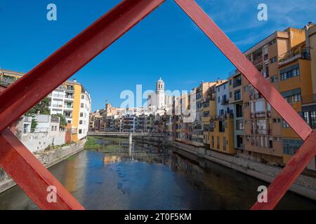 Girona ,with  the structure of Pont de les Peixateries Velles over the Onyar River with Gironas austere cathedral peeking over the colourful  rooftops Stock Photo