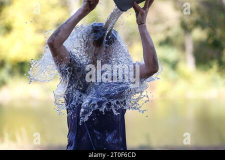 Outdoor shower and cold water bucket in a spa Stock Photo - Alamy