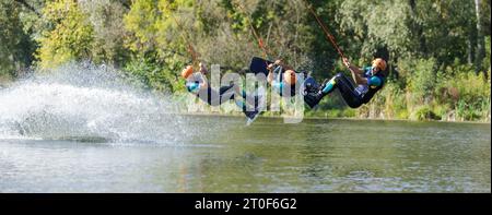 Sportsman on wakeboard performing back roll inversion on the river. Collage of serial shooting Stock Photo