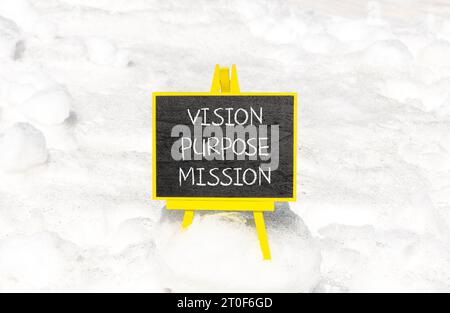 Vision purpose mission symbol. Concept word Vision Purpose Mission on beautiful black blackboard. Beautiful white snow background. Business motivation Stock Photo