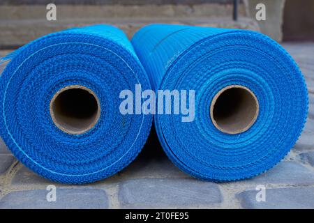 two rolls of mesh for the facade of the house Stock Photo