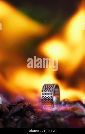 viking style silver ring, product photo with silver ring, ring forged in flames Stock Photo