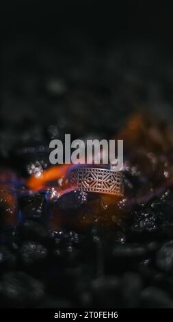 viking style silver ring, product photo with silver ring, ring forged in flames Stock Photo
