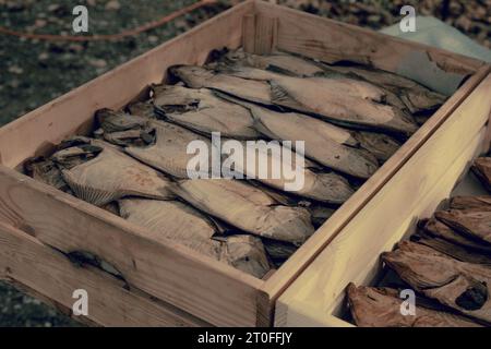Smoked fish in a craft paper box. Ready for product delivery. Baltic Sea fish. Smoked fish production concept. Stock Photo