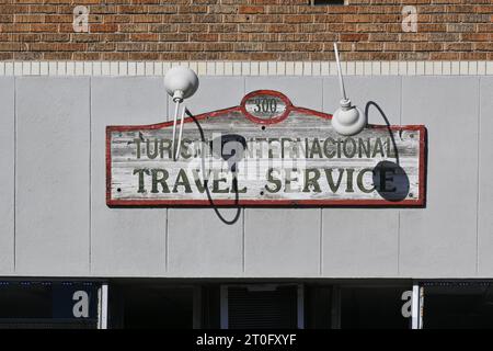 SANTA ANA, CALIFORNIA - 1 OCT 2023: Travel Service sign on Main Street in Downtown Santa Ana. Stock Photo