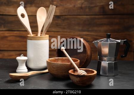 Set of different kitchen utensils on grey table Stock Photo