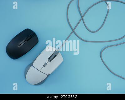 white wired mouse and wireless black mouse Stock Photo