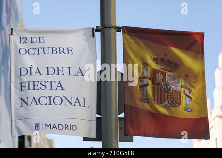 Madrid, Spain. 06th Oct, 2023. Gran Via Street is adorned with a Spanish flag ahead of the Spanish National Holiday celebration in Madrid. The Madrid City Council installed banners and the Spanish flag in celebration of the Spanish National Holiday that is celebrated every October 12. The day is also known as Dia dela Hispanidad. Credit: SOPA Images Limited/Alamy Live News Stock Photo
