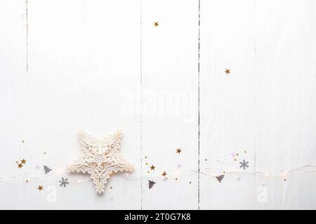 Christmas lights and star on white wooden background Stock Photo