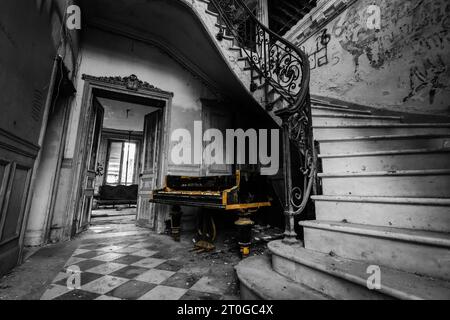 old broken piano in black and white with color editing Stock Photo
