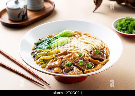 A bowl of Pork Intestines Noodles Stock Photo