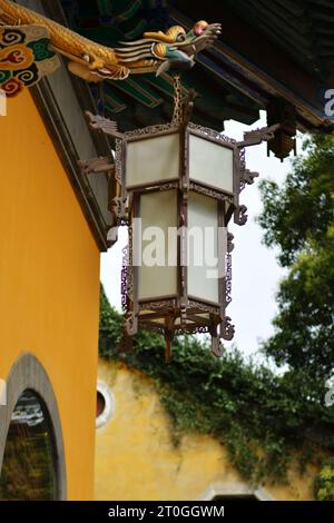 Lantern hanging under the eaves of the house Stock Photo - Alamy