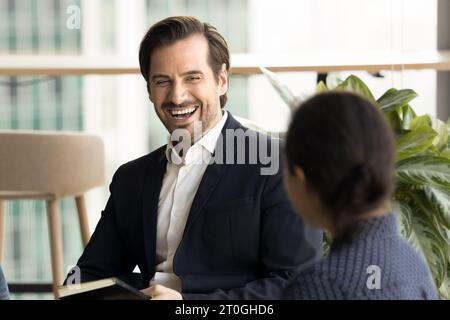 Happy business colleagues discussing creative ideas for project Stock Photo