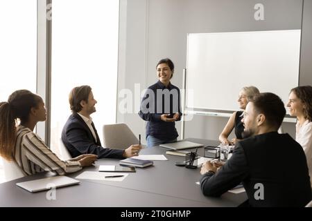 Happy creative multiethnic team of employees working on project together Stock Photo
